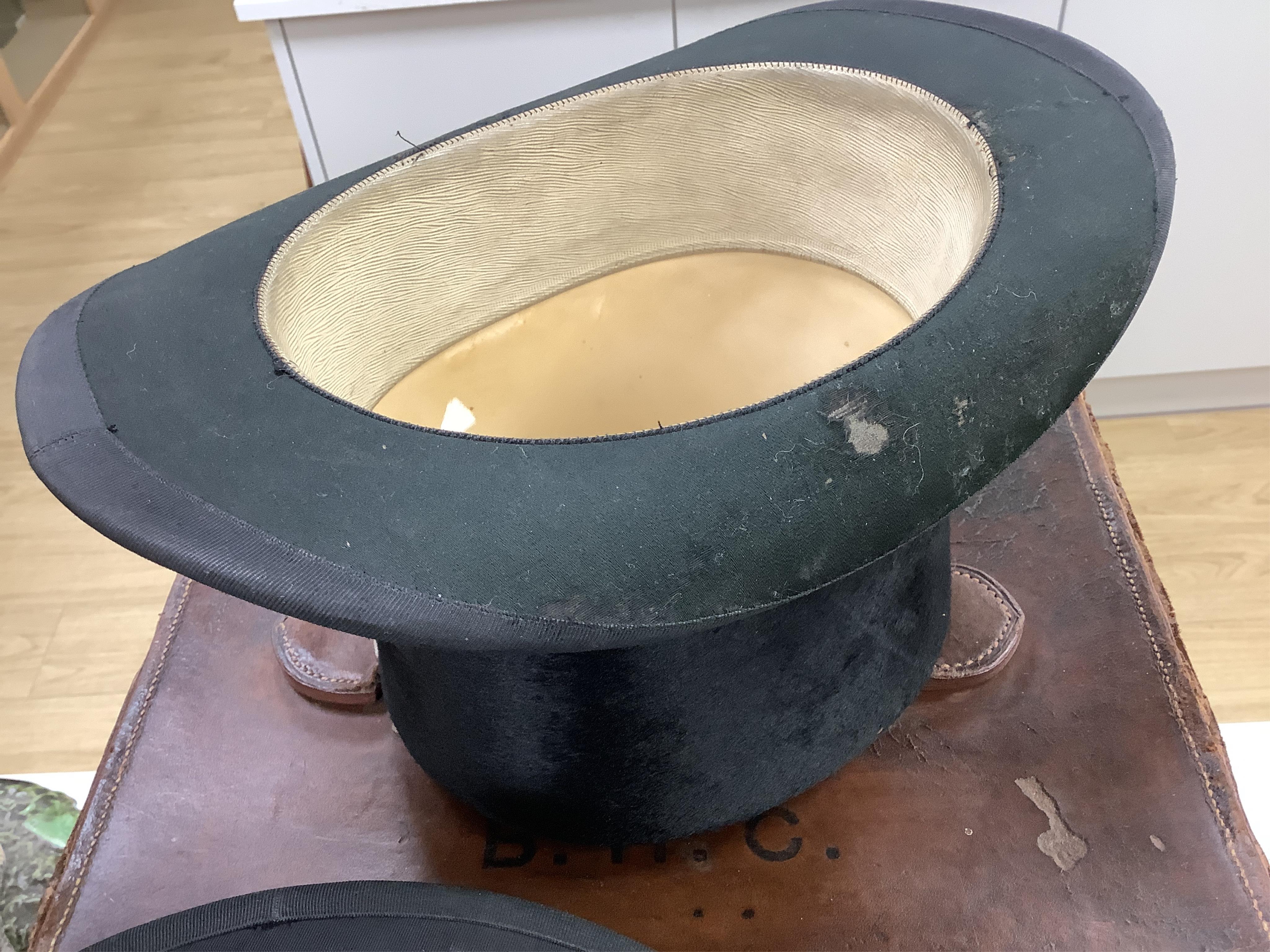 A Scott & Co. top hat with brush in leather case, together with a cased opera hat.